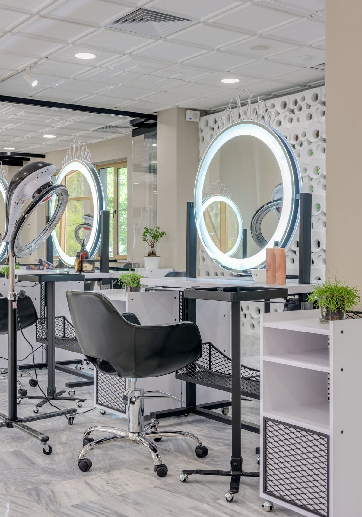 Bright, modern salon interior with illuminated styling mirrors